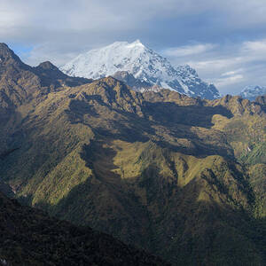 Majestic Andes Mountain Peaks Under Cloudy Sky by Brandon Wichmann