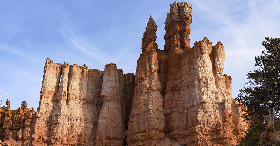 Majestic Rock Formations Under Blue Sky in Bryce Canyon National Park Photograph by Brandon Wichmann