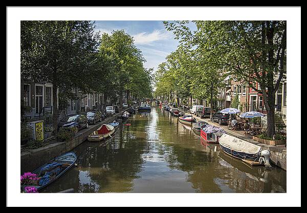 Serene Amsterdam Canal With Boats And Trees Framed Print
