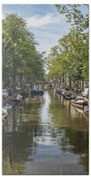 Serene Amsterdam Canal With Boats And Trees Beach Towel