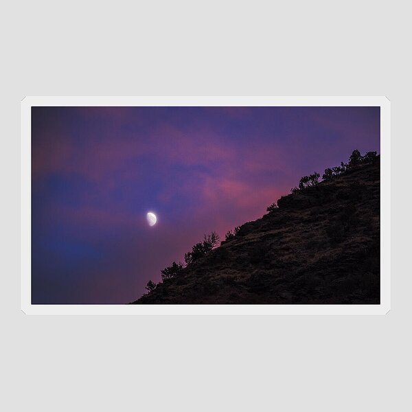Moonlit Evening Over Silhouetted Hills Sticker