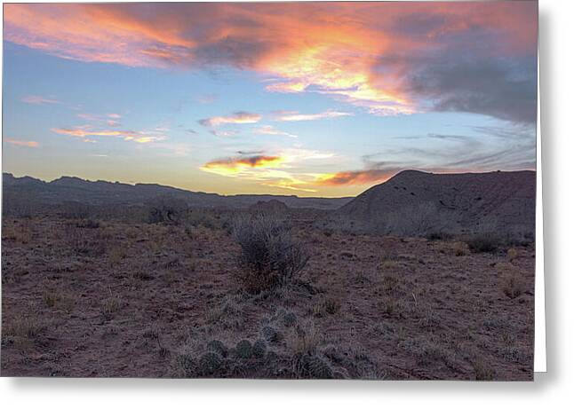 Desert Sunset Over Rugged Terrain Greeting Card