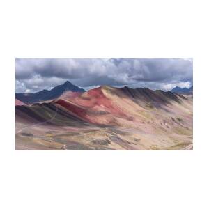 Rainbow Mountain Range under Cloudy Skies by Brandon Wichmann