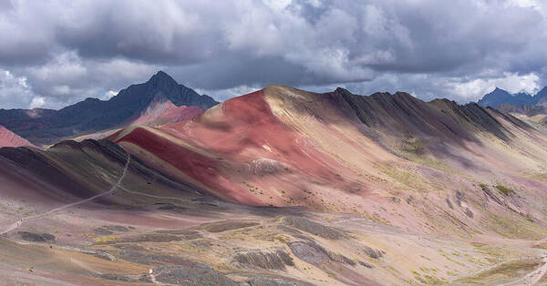 Rainbow Mountain Range Under Cloudy Skies Poster