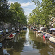 Serene Amsterdam Canal With Boats And Trees Poster