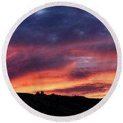 Vivid Twilight over Rocky Silhouette Round Beach Towel
