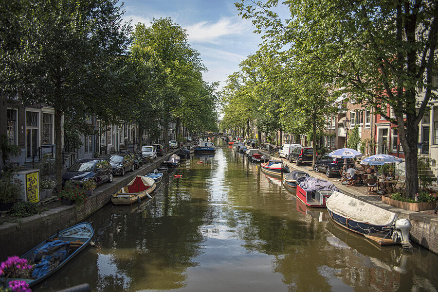 Serene Amsterdam Canal with Boats and Trees Photograph by Brandon Wichmann