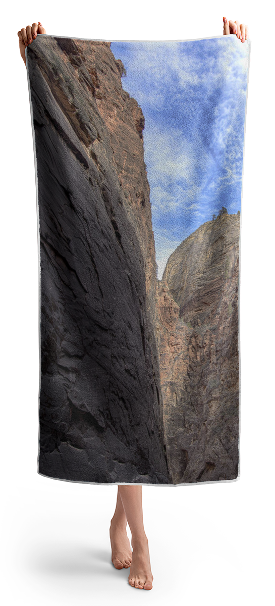 Towering Canyon Cliffs And Blue Sky Beach Towel