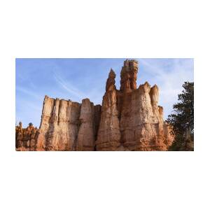 Majestic Rock Formations Under Blue Sky in Bryce Canyon National Park by Brandon Wichmann Majestic Rock Formations Under Blue Sky in Bryce Canyon National Park by Brandon Wichmann