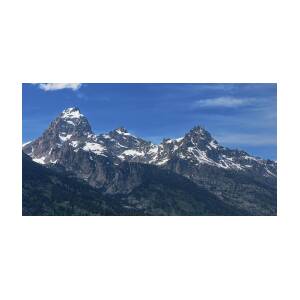 Snow-Capped Teton Mountain Peaks Under Blue Sky by Brandon Wichmann