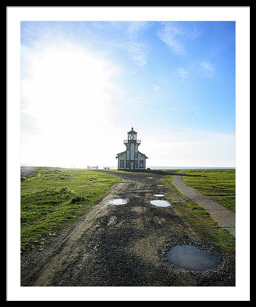 Lighthouse Under A Bright Sky Framed Print