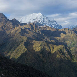 Majestic Andes Mountain Peaks Under Cloudy Sky by Brandon Wichmann