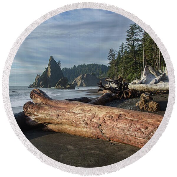 Driftwood on a Pebbled Beach Round Beach Towel