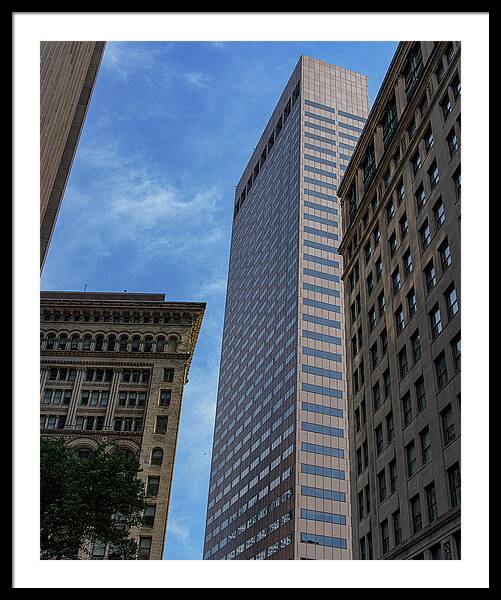 Skyscrapers Against Blue Sky Framed Print
