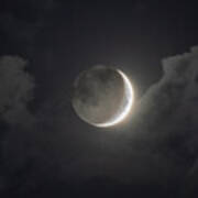 Shimmering Crescent Among Clouds Art Print