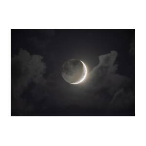 Shimmering Crescent Among Clouds by Brandon Wichmann