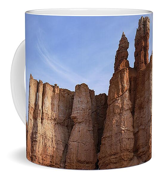 Majestic Rock Formations Under Blue Sky In Bryce Canyon National Park Coffee Mug