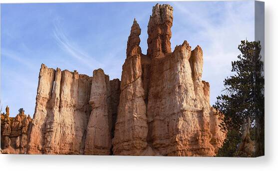 Majestic Rock Formations Under Blue Sky in Bryce Canyon National Park Canvas Art Print by Brandon Wichmann