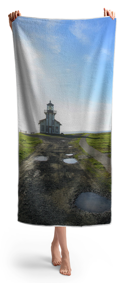 Lighthouse Under A Bright Sky Beach Towel
