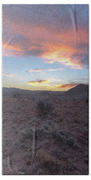 Desert Sunset Over Rugged Terrain Beach Towel