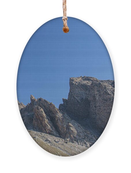 Majestic Mountain Peaks Under Blue Sky Ornament
