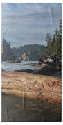 Driftwood on a Pebbled Beach Beach Towel