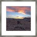 Desert Sunset Over Rugged Terrain Framed Print