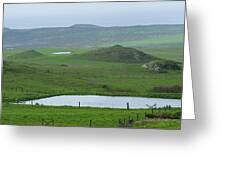 Tranquil Green Hills And Distant Sea Greeting Card