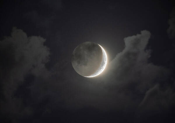 Shimmering Crescent Among Clouds Art Print