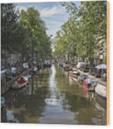 Serene Amsterdam Canal With Boats And Trees Wood Print