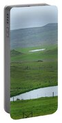 Tranquil Green Hills And Distant Sea Portable Battery Charger
