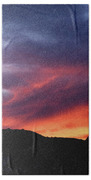 Vivid Twilight over Rocky Silhouette Beach Towel