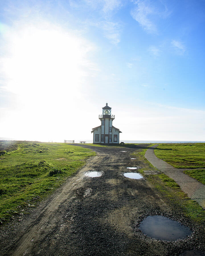 Lighthouse Under a Bright Sky Photograph by Brandon Wichmann