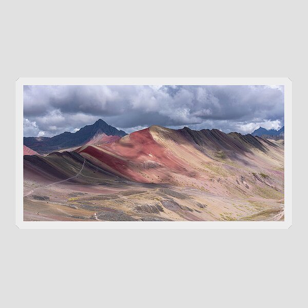 Rainbow Mountain Range Under Cloudy Skies Sticker