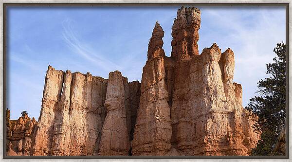 Majestic Rock Formations Under Blue Sky In Bryce Canyon National Park Framed Print