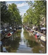 Serene Amsterdam Canal With Boats And Trees Canvas Print