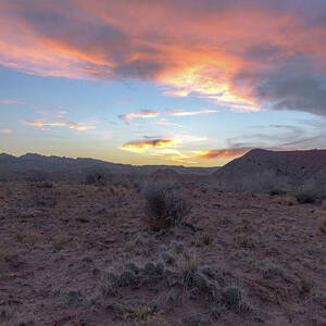 Desert Sunset Over Rugged Terrain by Brandon Wichmann