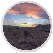 Desert Sunset Over Rugged Terrain Round Beach Towel